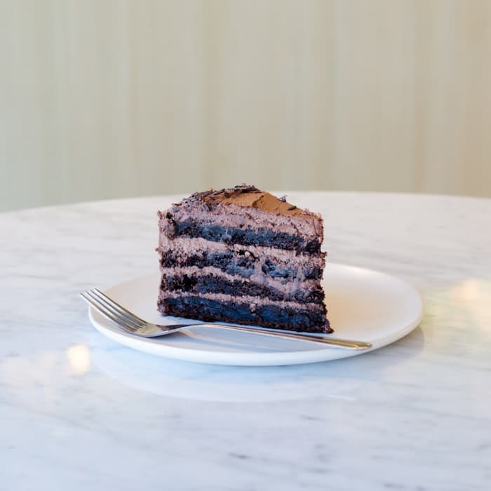 A slice of layered chocolate cake